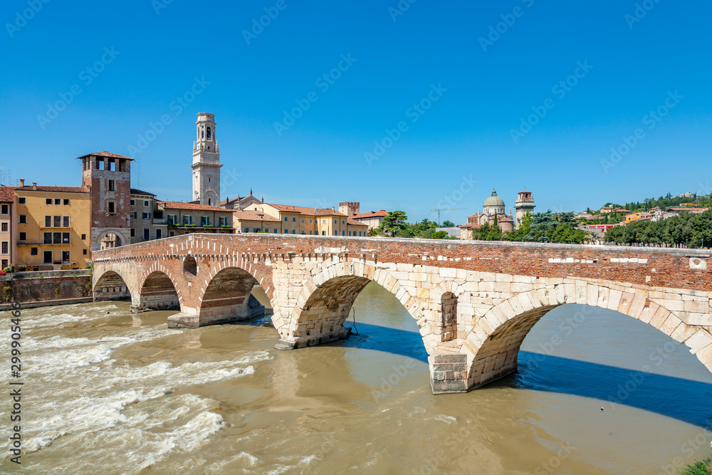the old roman bridge Ponte di Pietra in Verona  spans the river Etsch