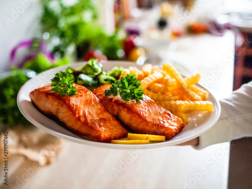 Bilde på lerret Fried salmon, French fries and vegetables