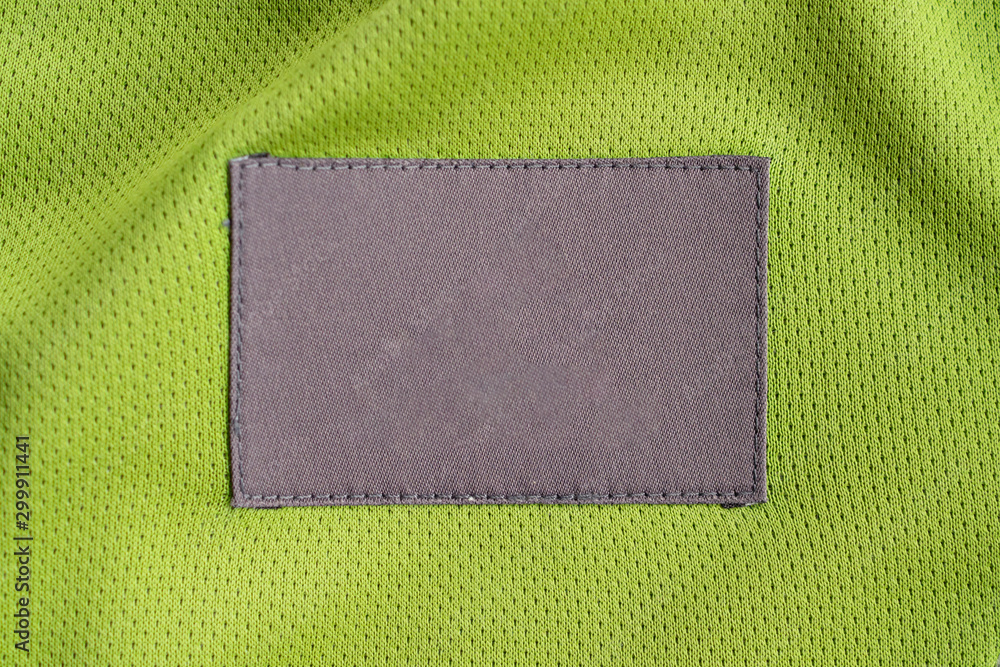 Fototapeta premium laundry care clothing label patch on polyester fabric jersey sport texture