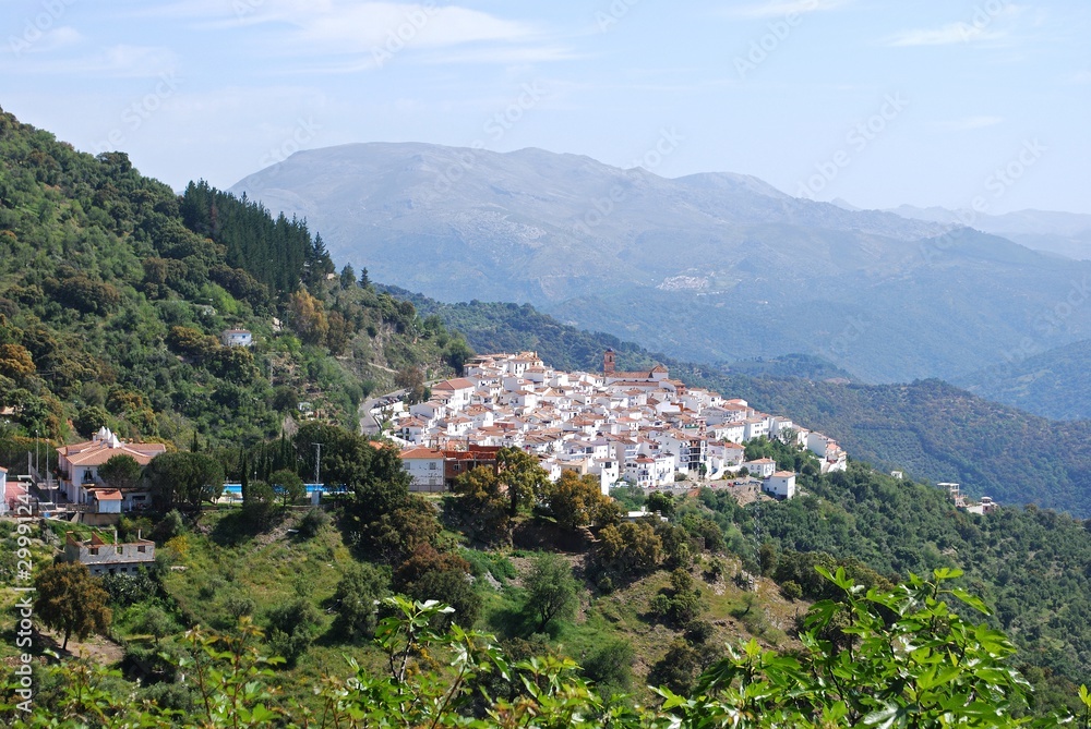 Elevated view of the white village surrounded by mountains, Algatocin, Spain.