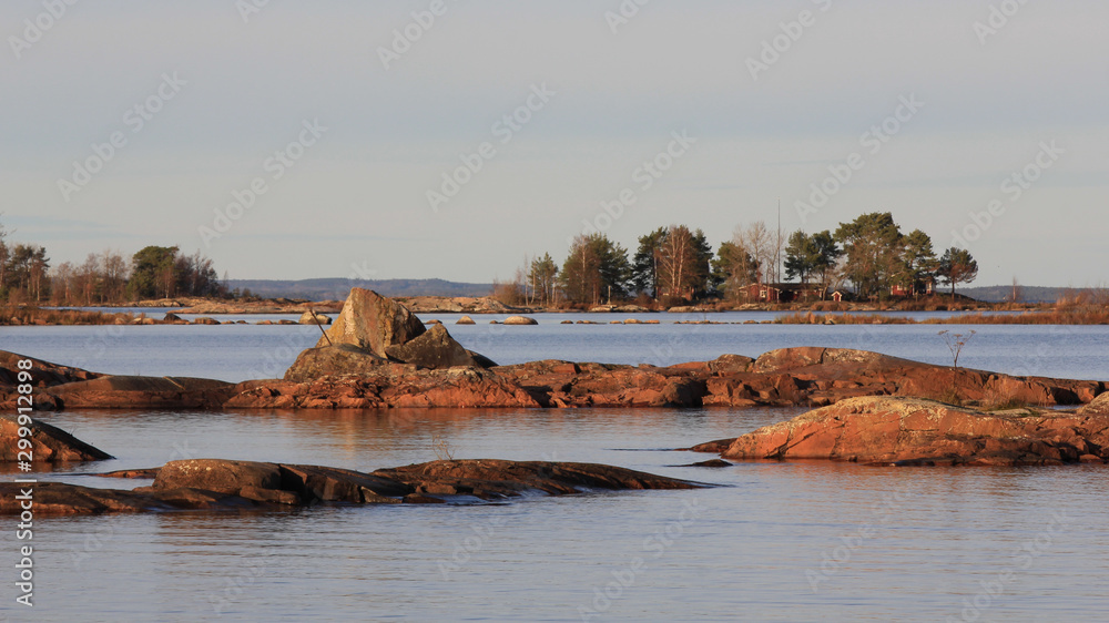 Beautiful rock formations and small island at the shore of Lake Vanern, Sweden.