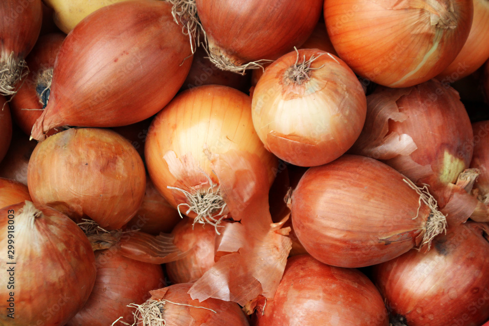 Ripe onions for sale at a market Ripe onions for sale at a market