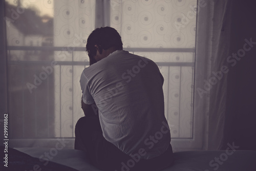 Tableau sur toile depressive man sitting on bed in agony