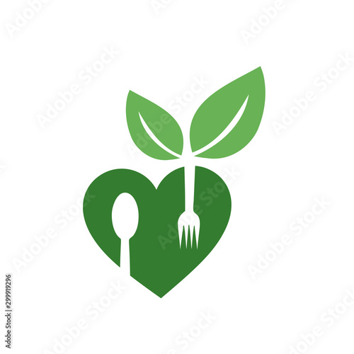 Love for vegan food- logo with organic leaves and spoon forks for organic Vegetarian friendly diet photo