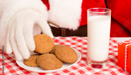 Christmas cookies and glass of milk preparing for Santa photo