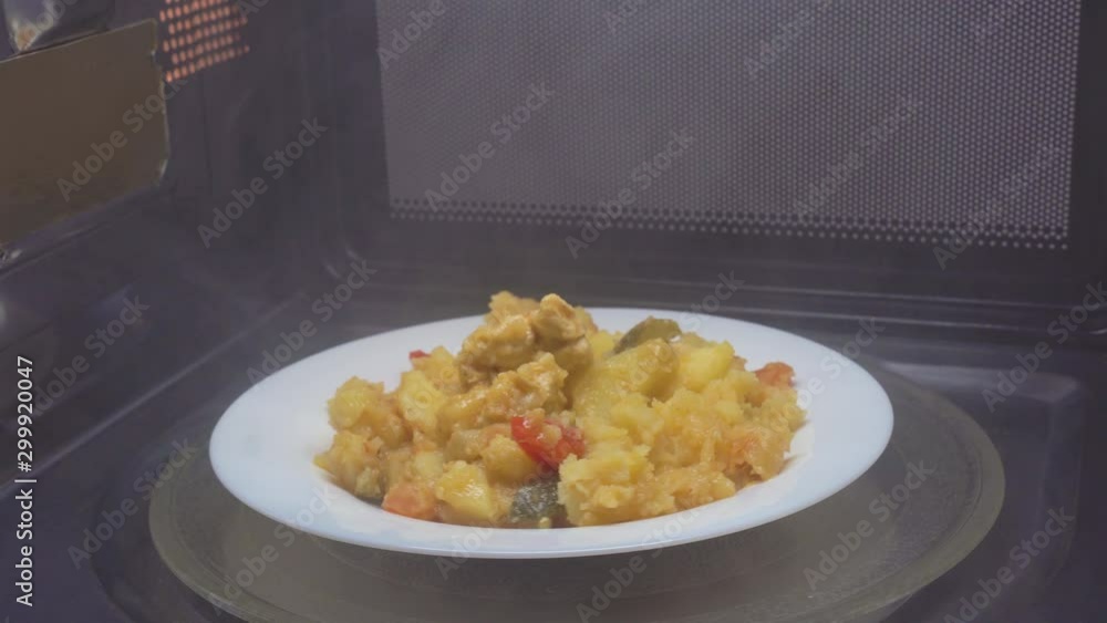 Making microwave meal. Macaroni and cheese in bowl microwaving top view
