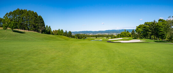 Golf Course with beautiful green field. Golf course with a rich green turf beautiful scenery.