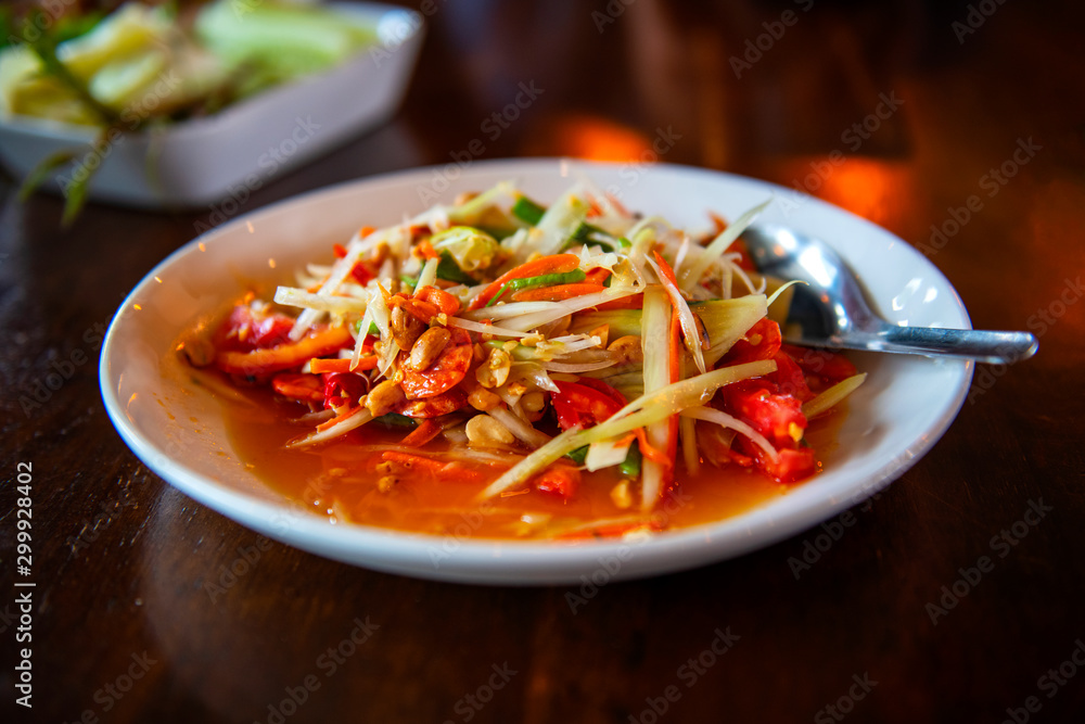 Papaya salad, delicious, sweet and sour, spicy seasoning cooking from papaya a popular country Thailand Papaya salad, delicious, sweet and sour, spicy seasoning cooking from papaya a popular country Thailand