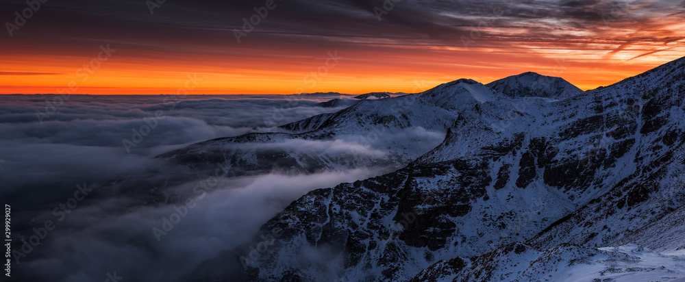Sunset in Kopa Kondracka in Polish Tatra Mountains in winter snow weather conditions