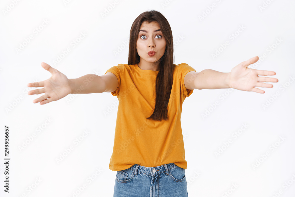 Silly cute good-looking european woman in yellow t-shirt, spread hands sideways and folding lips in kiss, waiting someone fall into her arms to cuddle, hug, standing flirty over white background Silly cute good-looking european woman in yellow t-shirt, spread hands sideways and folding lips in kiss, waiting someone fall into her arms to cuddle, hug, standing flirty over white background