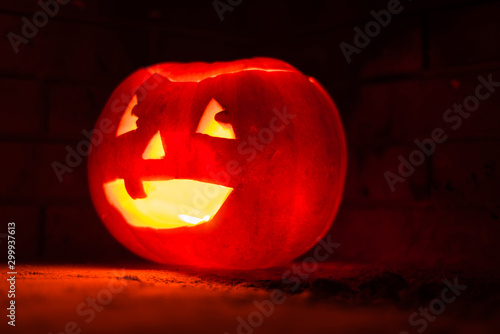 A carved pumpkin with light coming from inside