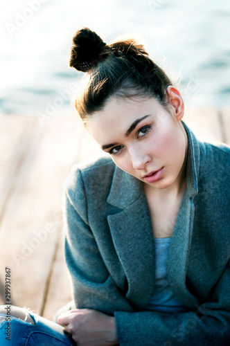 Close up portrait of a beautiful brunette woman outdoors