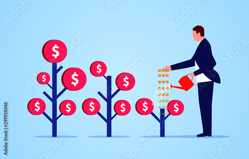 Business investment, businessman watering and fertilizing money tree