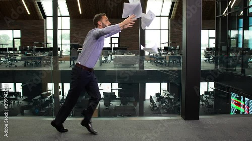 Bullet time shot of clumsy businessman tripping in the office photo