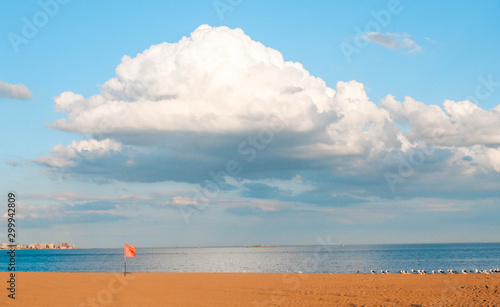 Big white cloud over the beach creating a beautiful scene