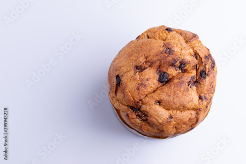 Christmas chocolate cake panettone on white background, soft light, top view, also know as chocotone panetone