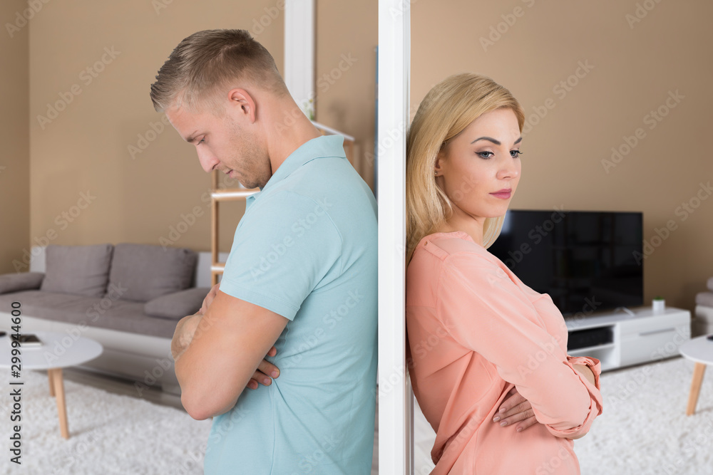 Obraz premium Angry Couple Standing Back To Back In Their House