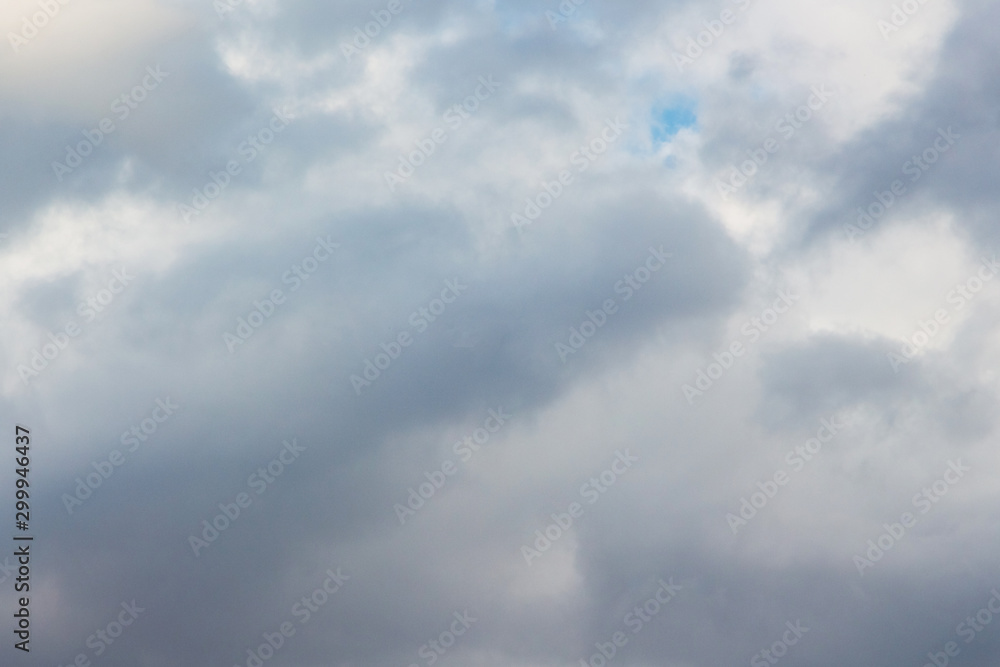 Gray rainy inhomogeneous clouds. Background for design_