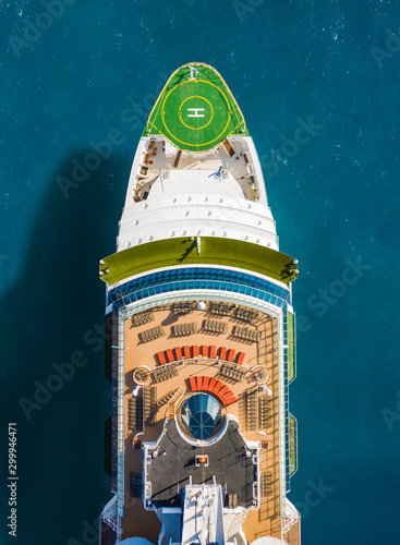 Top down aerial view of the bow of the cruise ship with helipad . horizontal frame