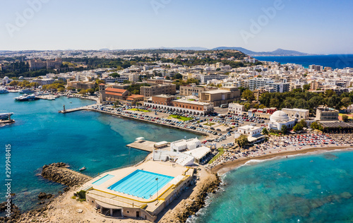 Aerial birds eye view drone photo of Rhodes city island, Dodecanese, Greece. Panorama with Mandraki port, lagoon and clear blue water. Famous tourist destination in South Europe