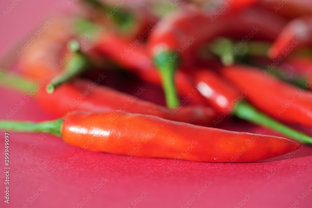 red chili peppers on red background red chili peppers on red background