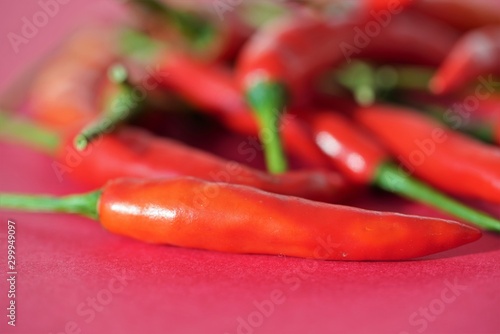 red chili peppers on red background