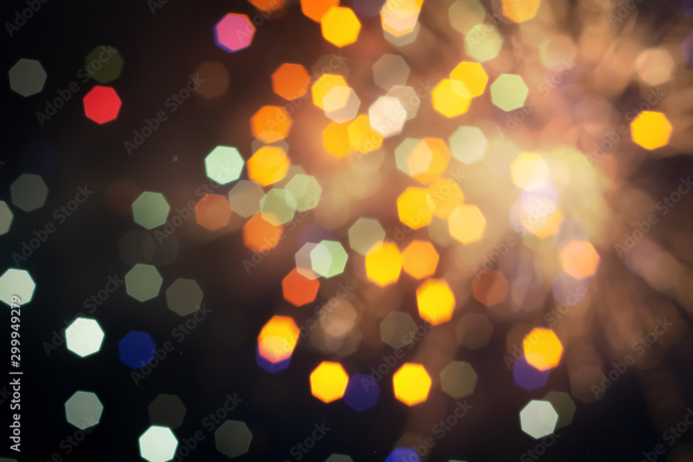 Defocused of beautiful  polygon lights..Bokeh of multi colorful light  in 7 polygon heptagon in smoky night background .