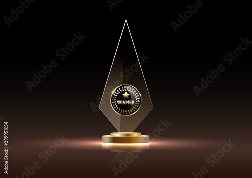 Glass shining golden trophy winner. Isolated on black.
