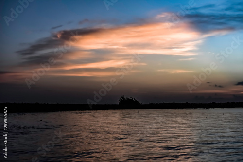 sunrise over lake wiith clouds © STANLEY