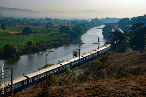 A passenger train amidst greenery at Kamshet near Pune India.