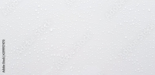 Raining or water drop on gray or white stainless steel wall for background  - Abstract wallpaper concept 