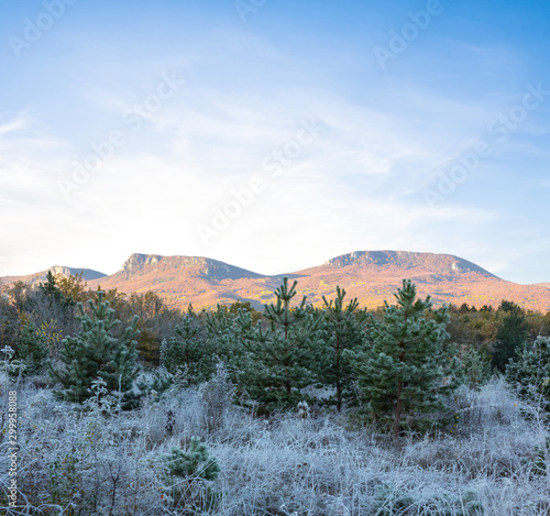 mountain ridge and frozen field at the early morning