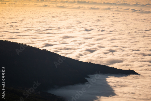 sea of clouds below the summit of Teide volcano in Tenerife