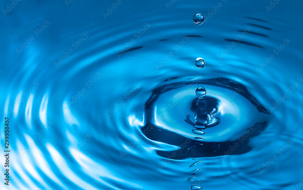 water drop and water splash, blue water surface water drop and water splash, blue water surface