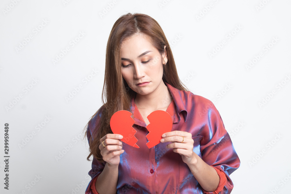 Beautiful young Asian woman with broken heart. Beautiful young Asian woman with broken heart.