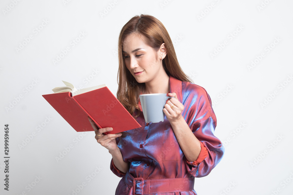 Young Asian woman with a book and cup of coffee. Young Asian woman with a book and cup of coffee.