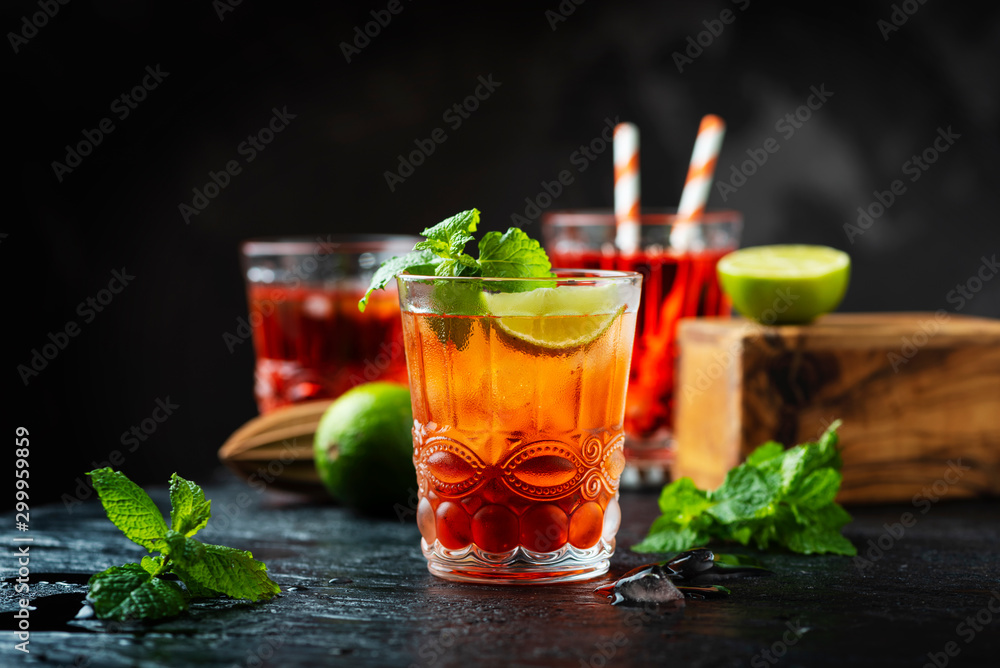 Red fresh cocktail with ice and lime Red fresh cocktail with ice and lime