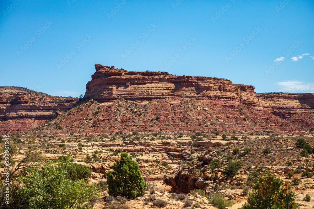 Utah State Route 95 to Capitol Reef National Park majestic wild and natural geography delights the eye with wild open blue skies and weathered cliffs and mesas