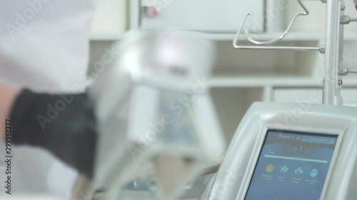 Woman getting cryolipolysis fat treatment procedure in professional cosmetic cabinet, closeup