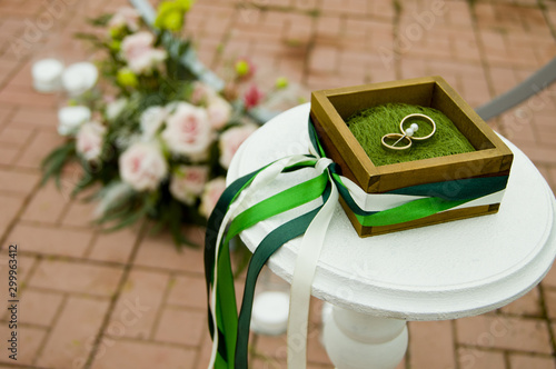 wedding rings on a stand