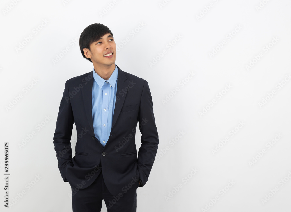 Young handsome asian business man looking to camera isolated on white background. Young handsome asian business man looking to camera isolated on white background.