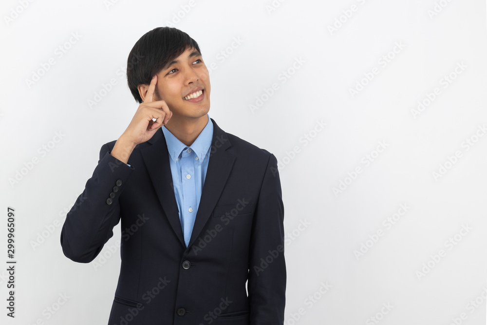 Young handsome asian business man thinking an idea while looking up isolated on white background. Young handsome asian business man thinking an idea while looking up isolated on white background.