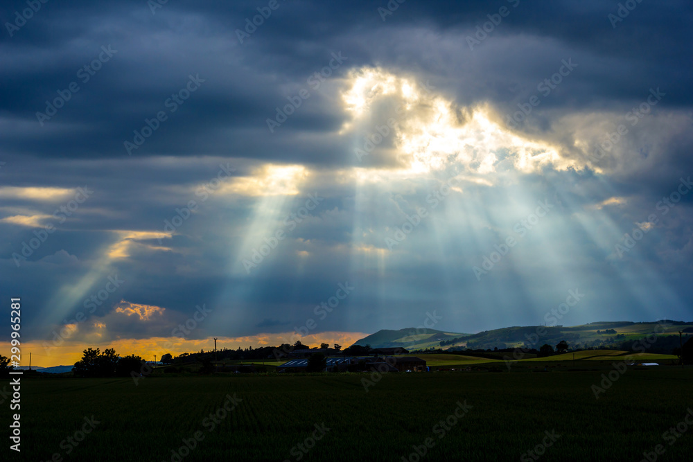 Rays of sun in the evening sky in Scotland