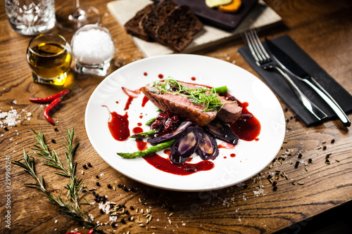 Duck breast served on a plate in restaurant