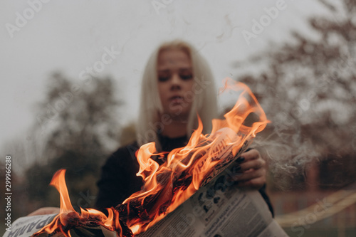 woman with fire in forest