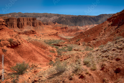 fantastic clay red castles in the sandy desert of the canyon Konorchek, in Kyrgyzstan 