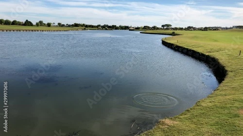 Golf ball falls in water