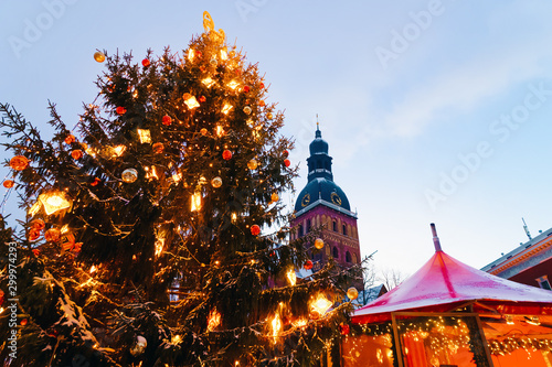 Snowcapped Christmas tree and Christmas market
