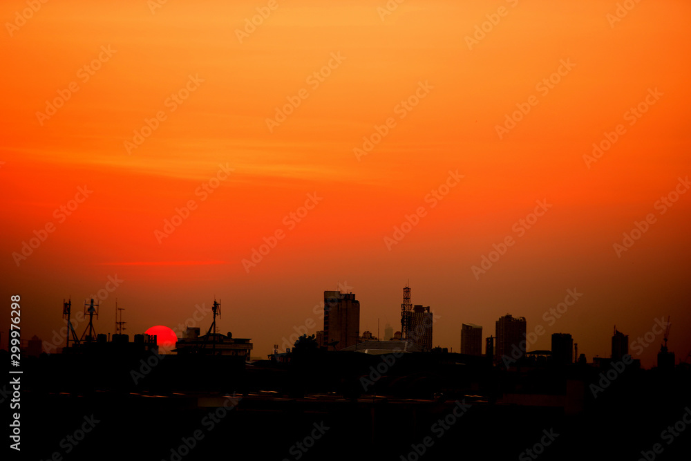 Sunset view Beautiful golden yellow sky in big cities