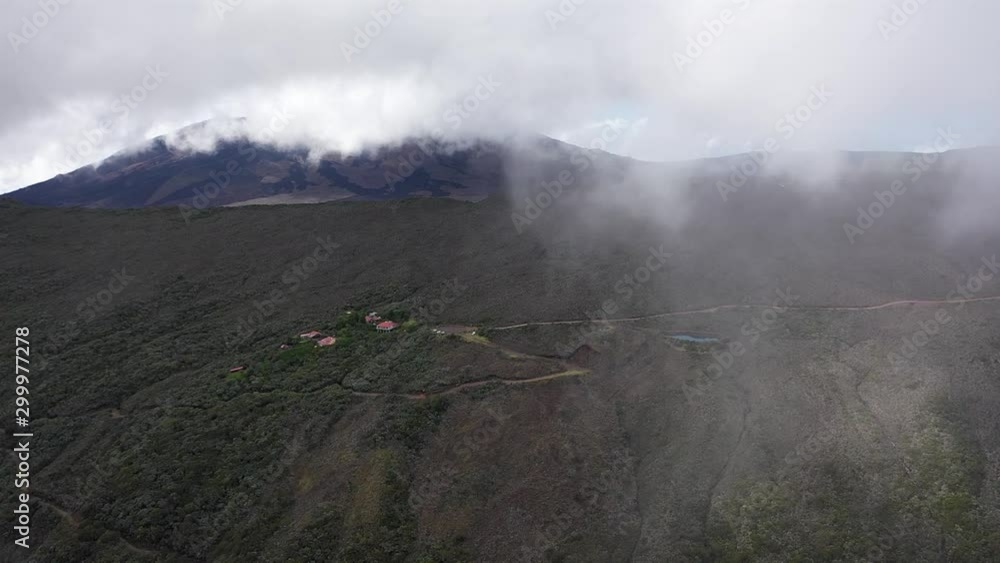 Aerial flight through clouds reveals mountainside, Reunion island, aerial view Aerial flight through clouds reveals mountainside, Reunion island, aerial view